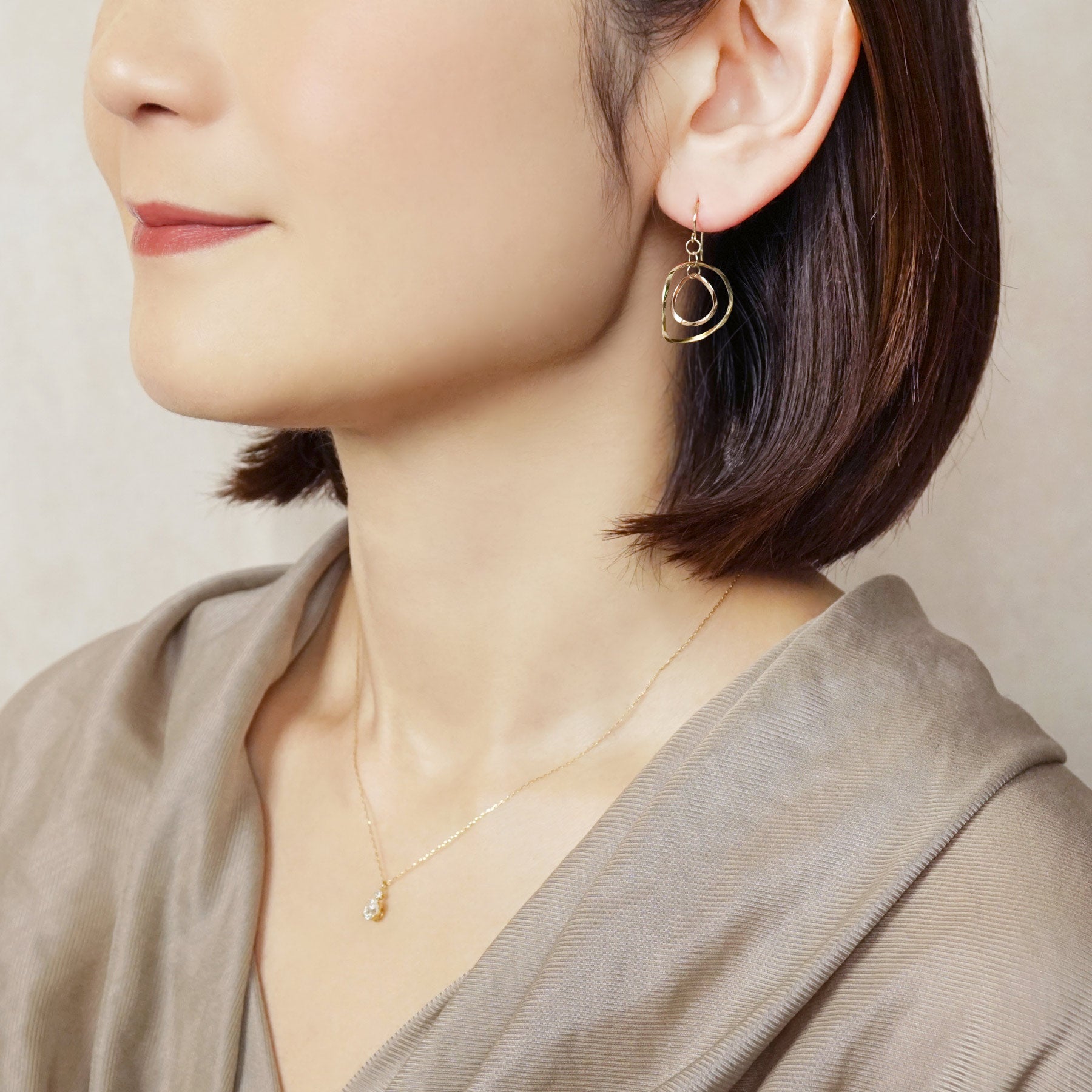 10K Twin Circle Swinging Earrings (Yellow Gold / Rose Gold) - Model Image