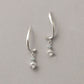 10K Ice Blue Diamond Twisted Earrings (White Gold) - Product Image