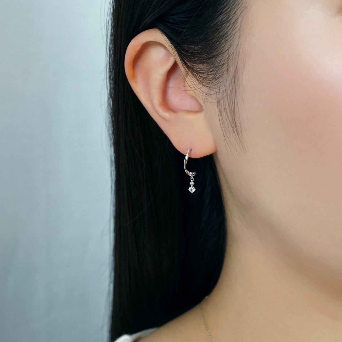 10K Ice Blue Diamond Twisted Earrings (White Gold) - Model Image