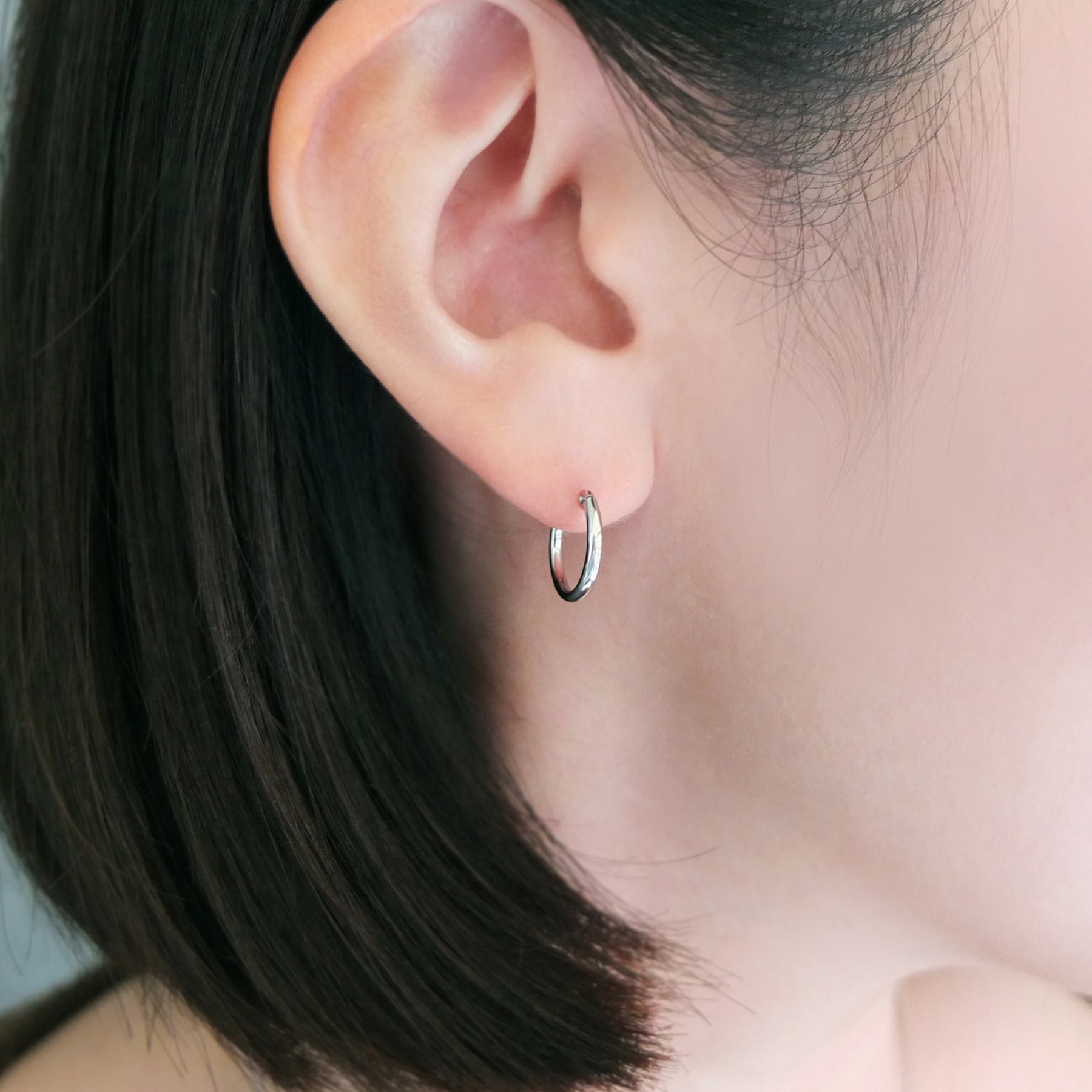 Platinum Pipe Hoop Earrings - Model Image