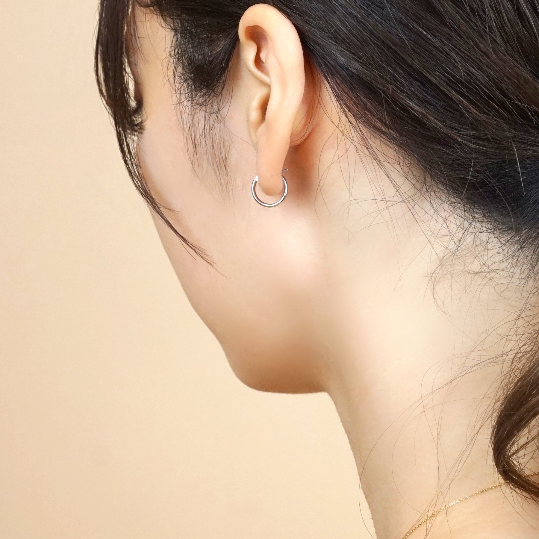 Platinum Pipe Hoop Earrings - Model Image
