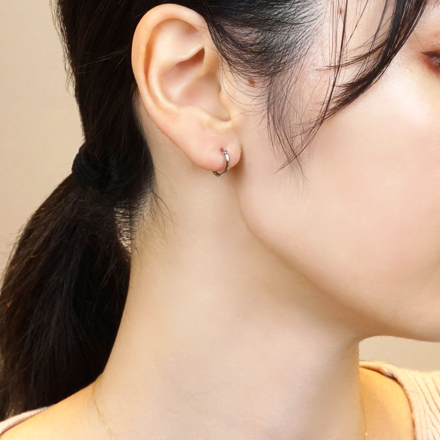 Platinum Pipe Hoop Earrings - Model Image