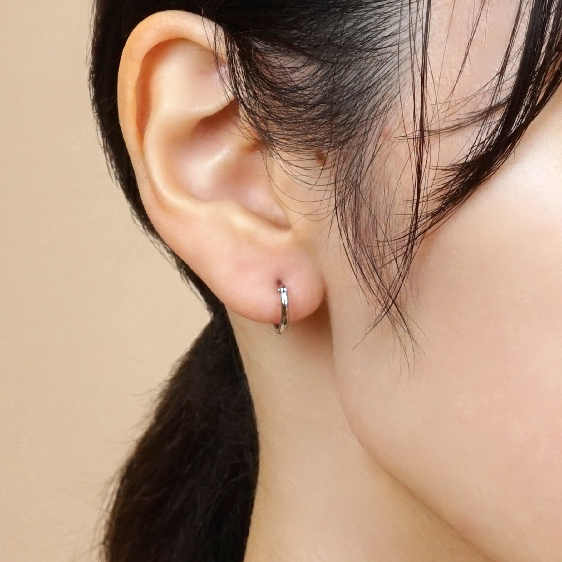 Platinum Pipe Hoop Earrings - Model Image