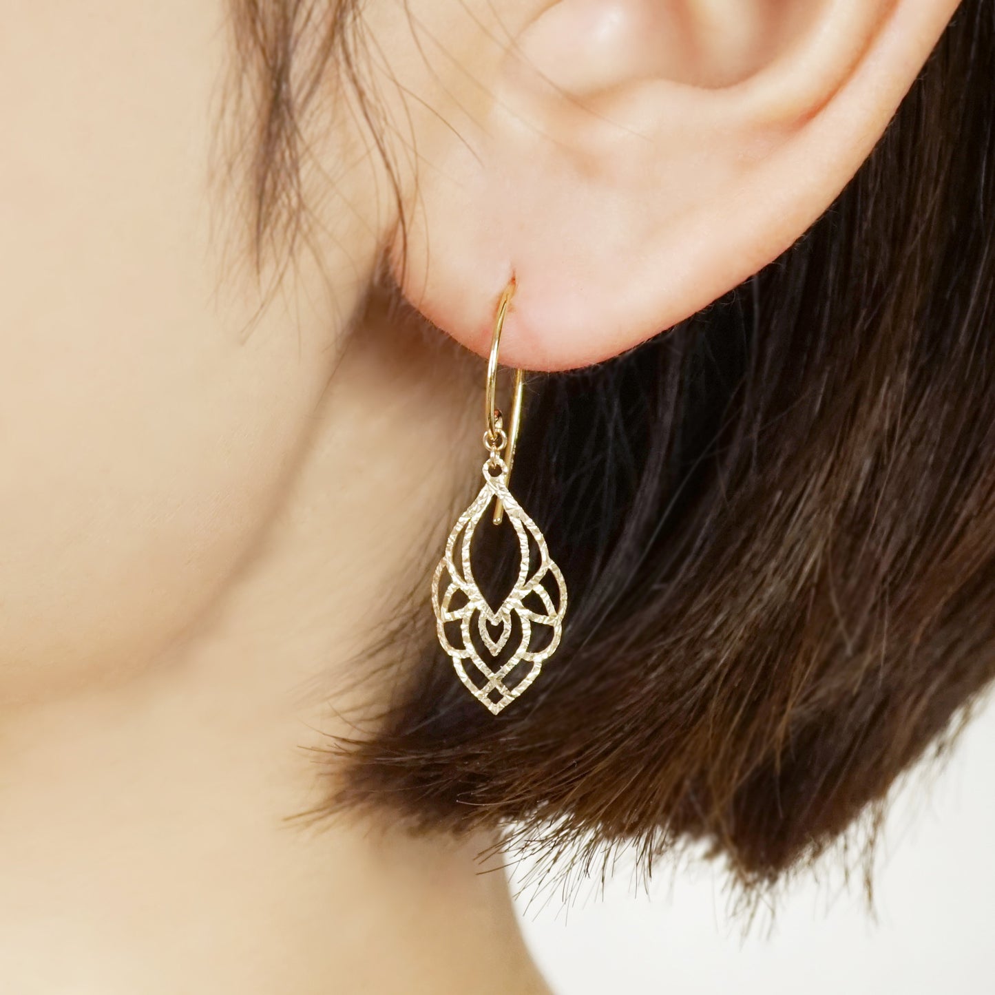 10K Openwork Leaf Earrings (Yellow Gold) - Model Image