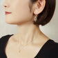 10K Openwork Leaf Earrings (Yellow Gold) - Model Image