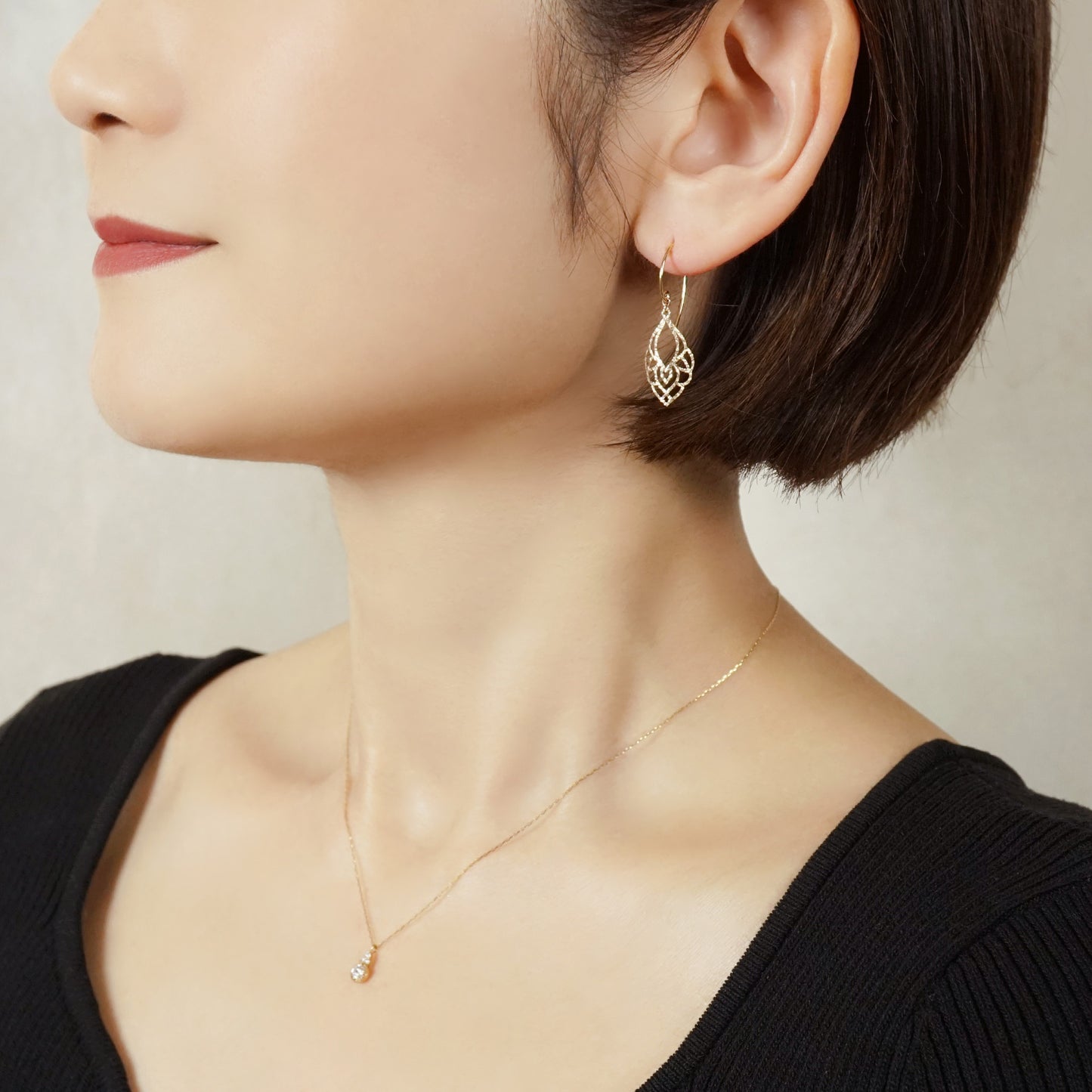10K Openwork Leaf Earrings (Yellow Gold) - Model Image