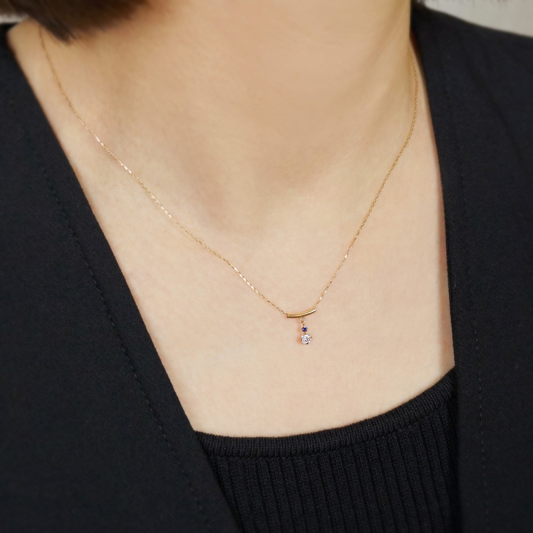 10K Shooting Star Moissanite Necklace (Yellow Gold) - Model Image