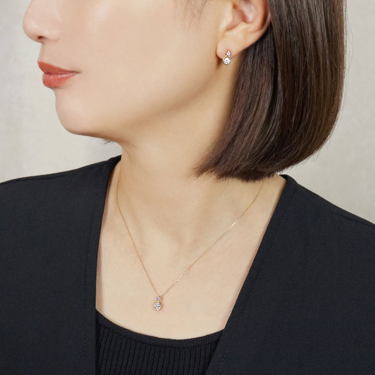 10K Sirius Moissanite Earrings (Yellow Gold) - Model Image