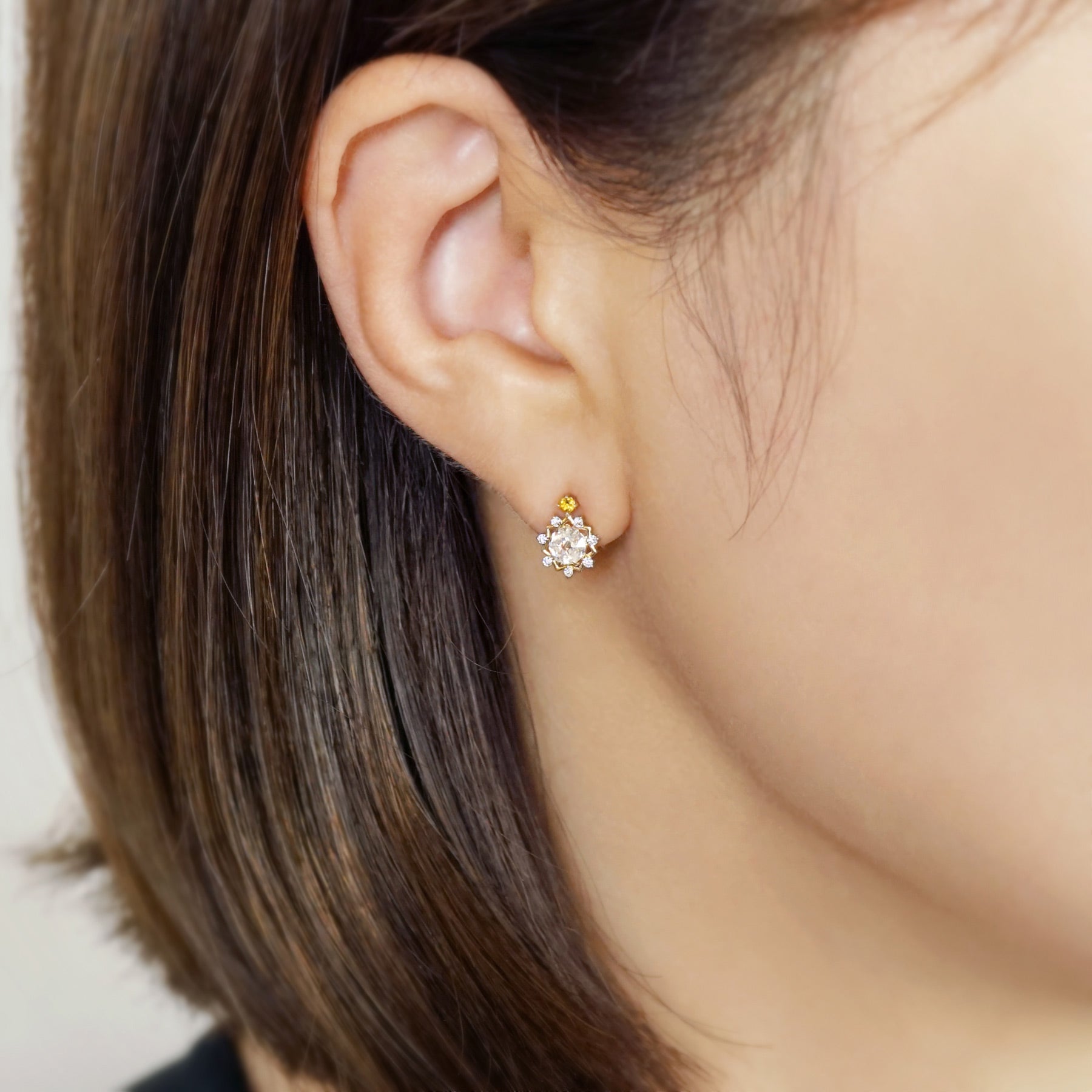 10K Sun Moissanite Earrings (Yellow Gold) - Model Image