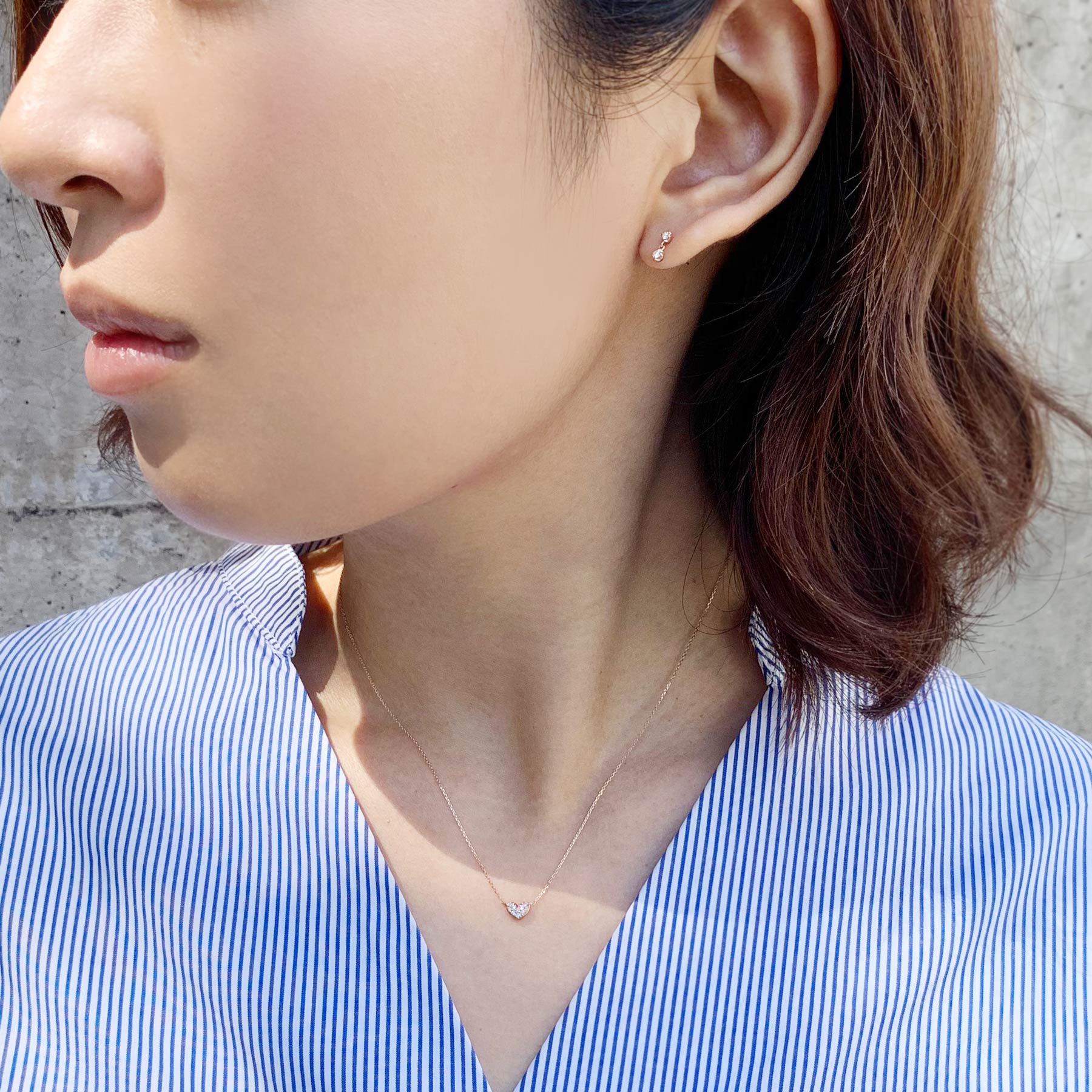 10K Twin Diamond Earrings (Rose Gold) - Model Image