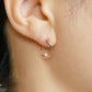 10K Cubic Zirconia Twisted Hoop Earrings (Rose Gold) - Model Image
