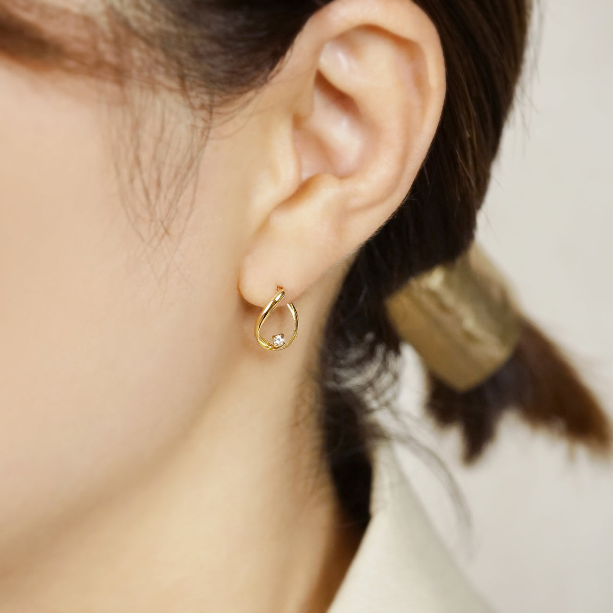 18K Diamond Twisted Hoop Earrings (Yellow Gold) - Model Image