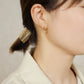 18K Diamond Twisted Hoop Earrings (Yellow Gold) - Model Image