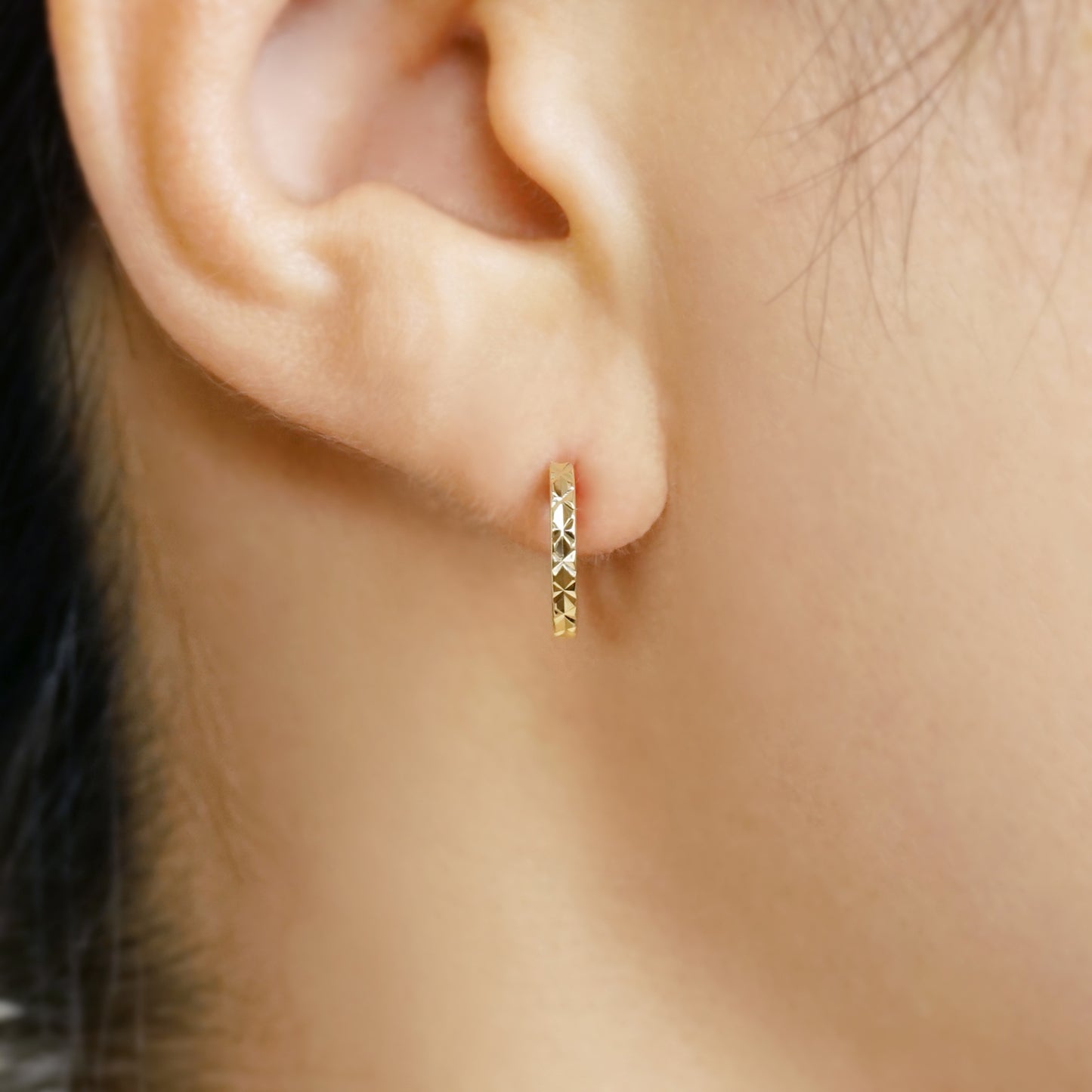 10K Faceted Hoop Earrings (Yellow Gold) - Model Image