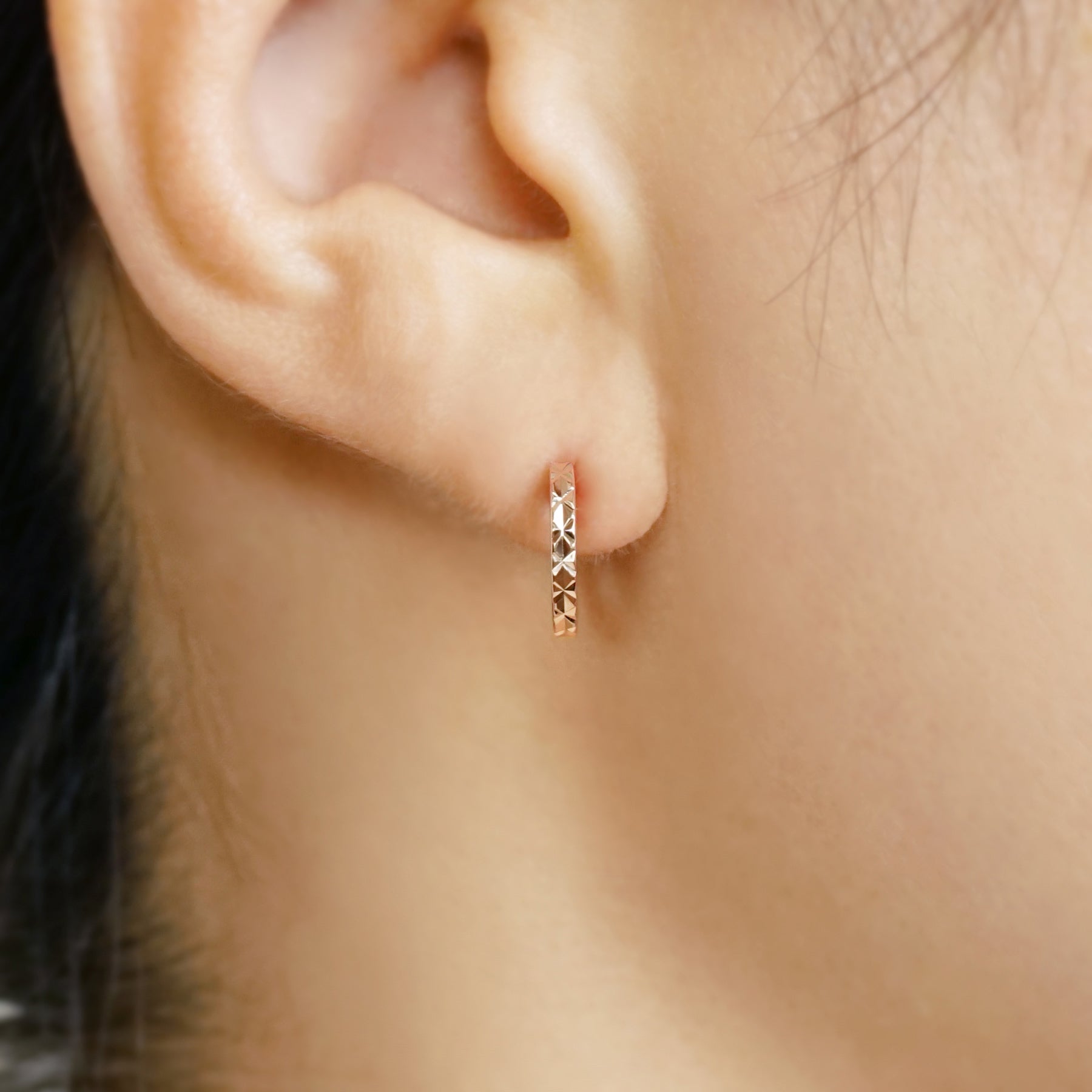 10K Faceted Hoop Earrings (Rose Gold) - Model Image