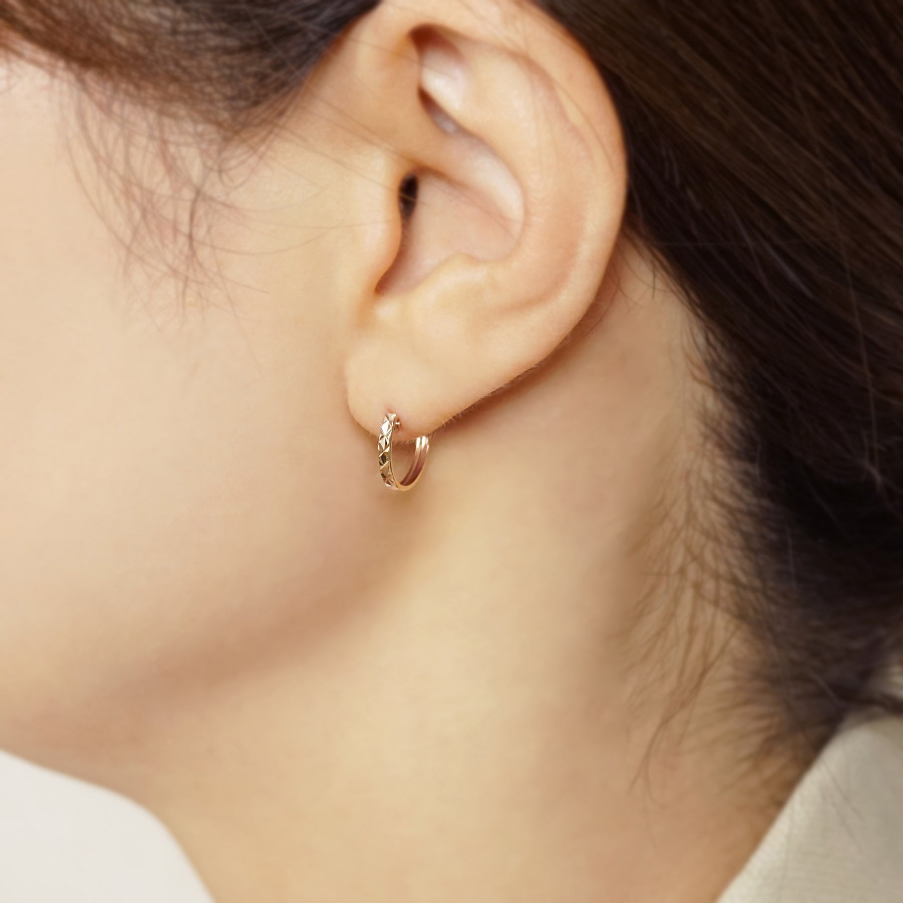 10K Faceted Hoop Earrings (Rose Gold) - Model Image