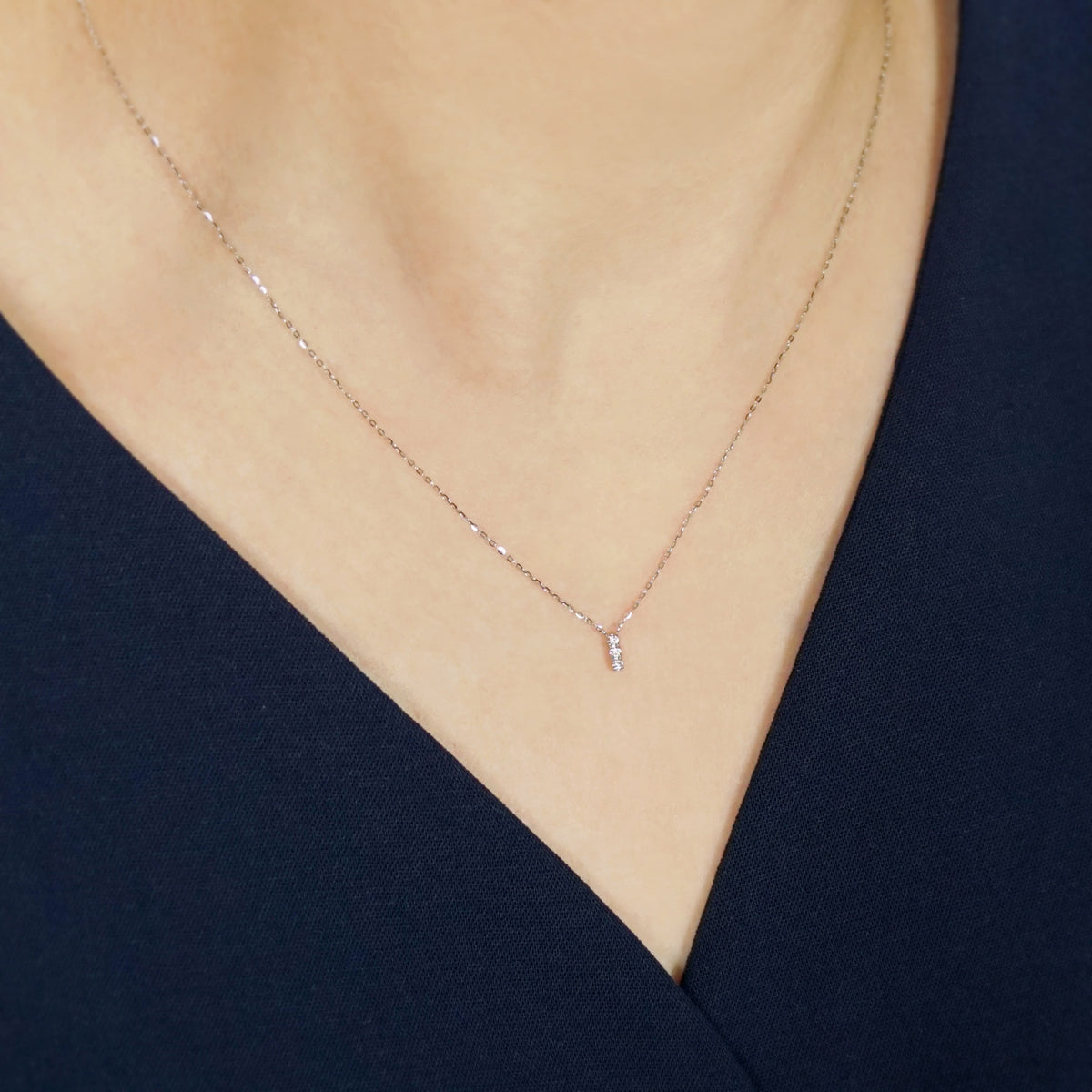 10K Diamond Trilogy Bar Necklace (White Gold) - Model Image