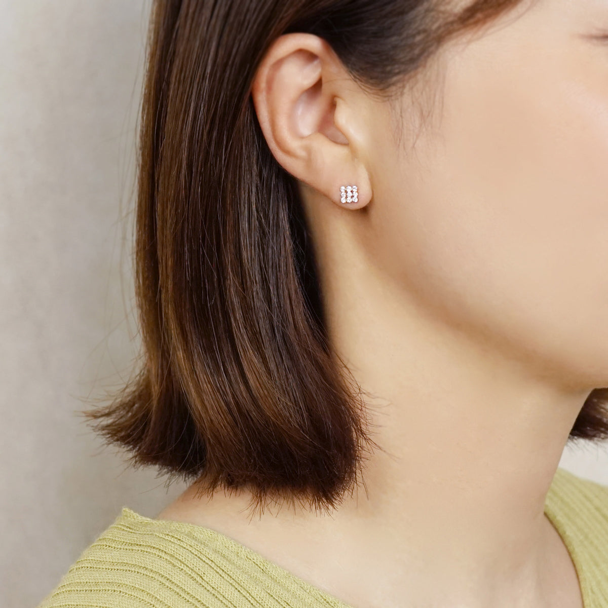 10K 9-Stone Square Stud Earrings (Yellow Gold) - Model Image