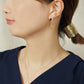 10K / 925 Sterling Silver Baguette Cut Twisted Line Swinging Earrings - Model Image