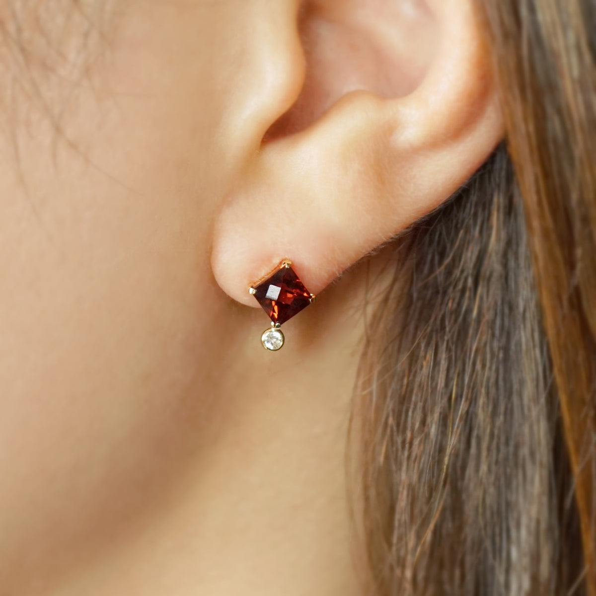 10K Garnet Checkerboard Cut Stud Earrings (Yellow Gold) - Model Image