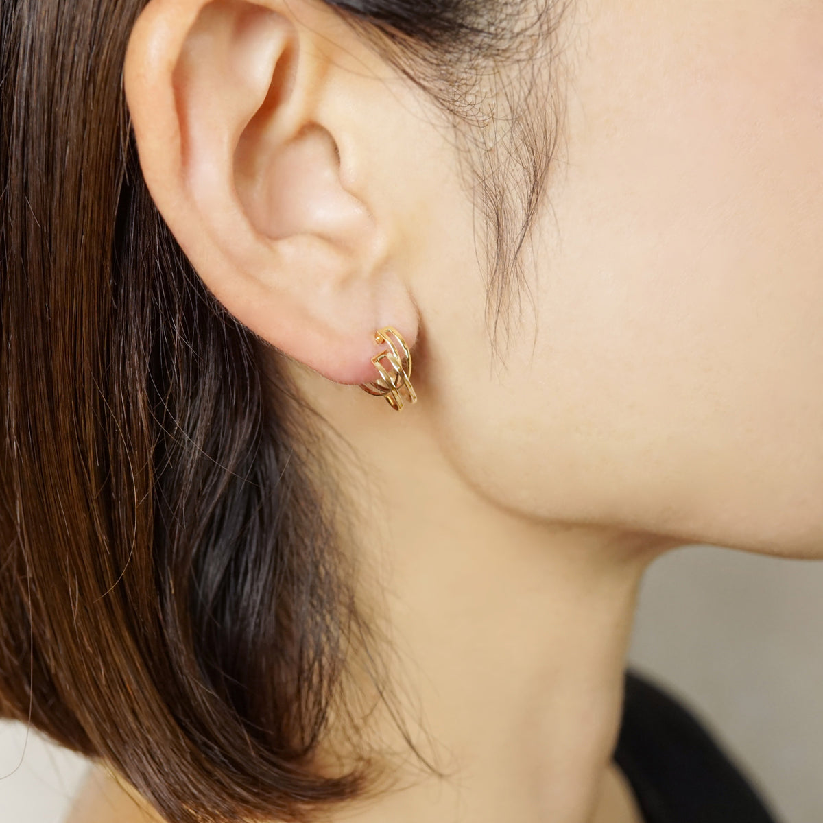 10K Double Hoop Earrings (Yellow Gold) - Model Image