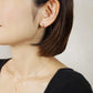 10K Plump Mini Hoop Earrings (Yellow Gold) - Model Image