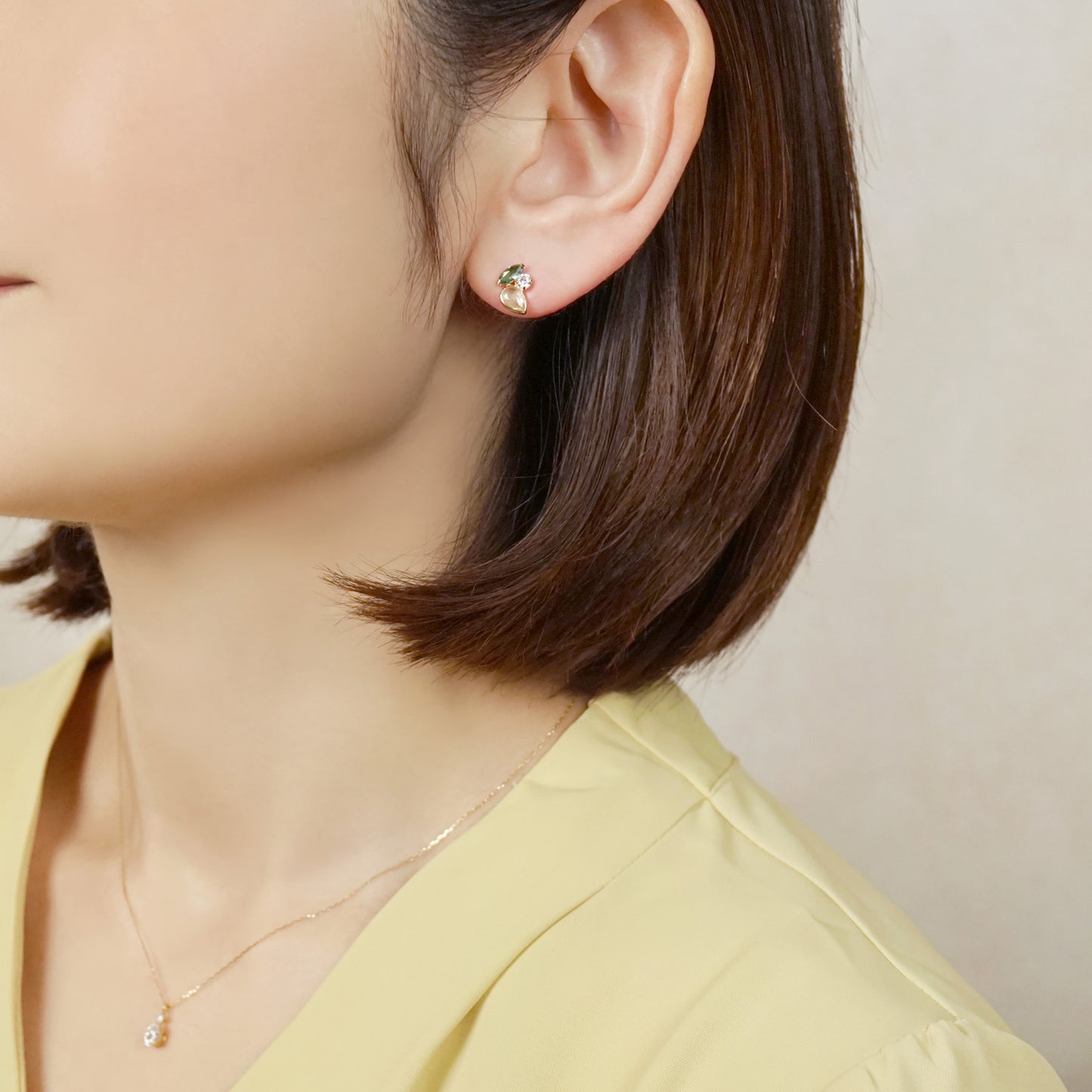 10K Green Gradation Stud Earrings (Yellow Gold) - Model Image