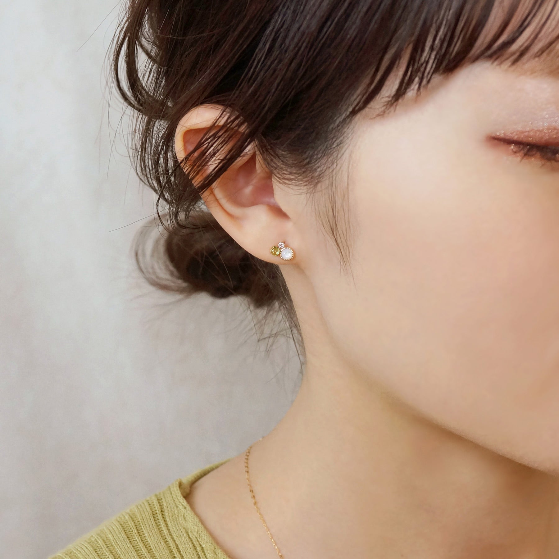 18K/10K Yellow Gold Peridot Stud Earrings - Model Image