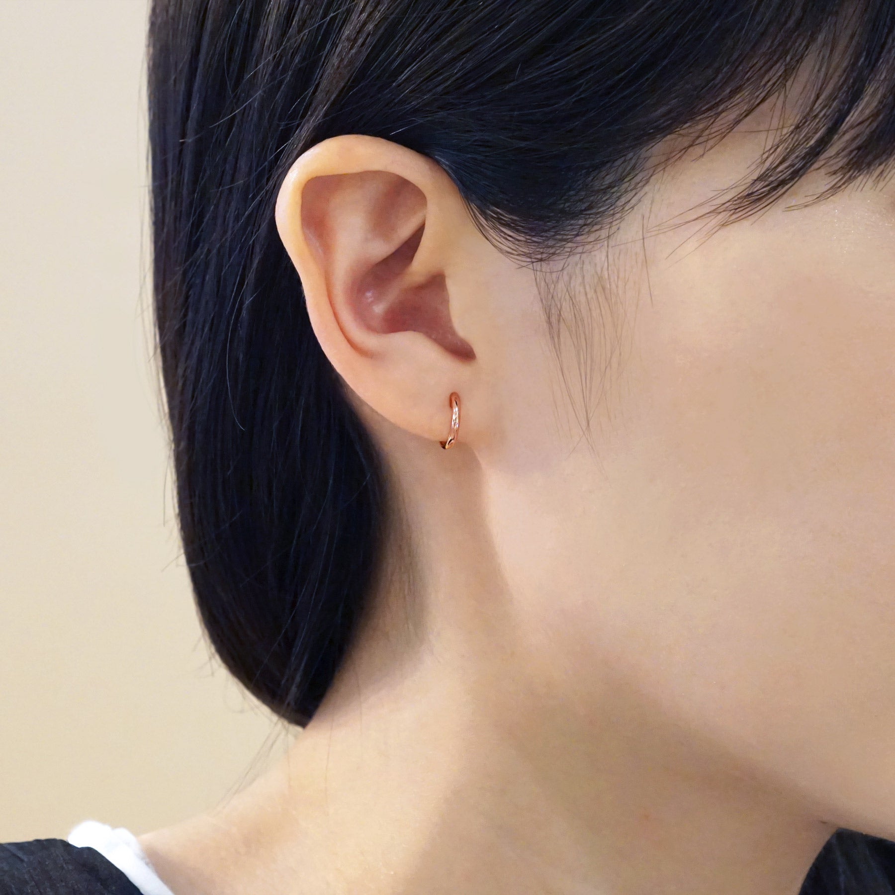 18K/10K Rose Gold Mini Hoop Earrings - Model Image