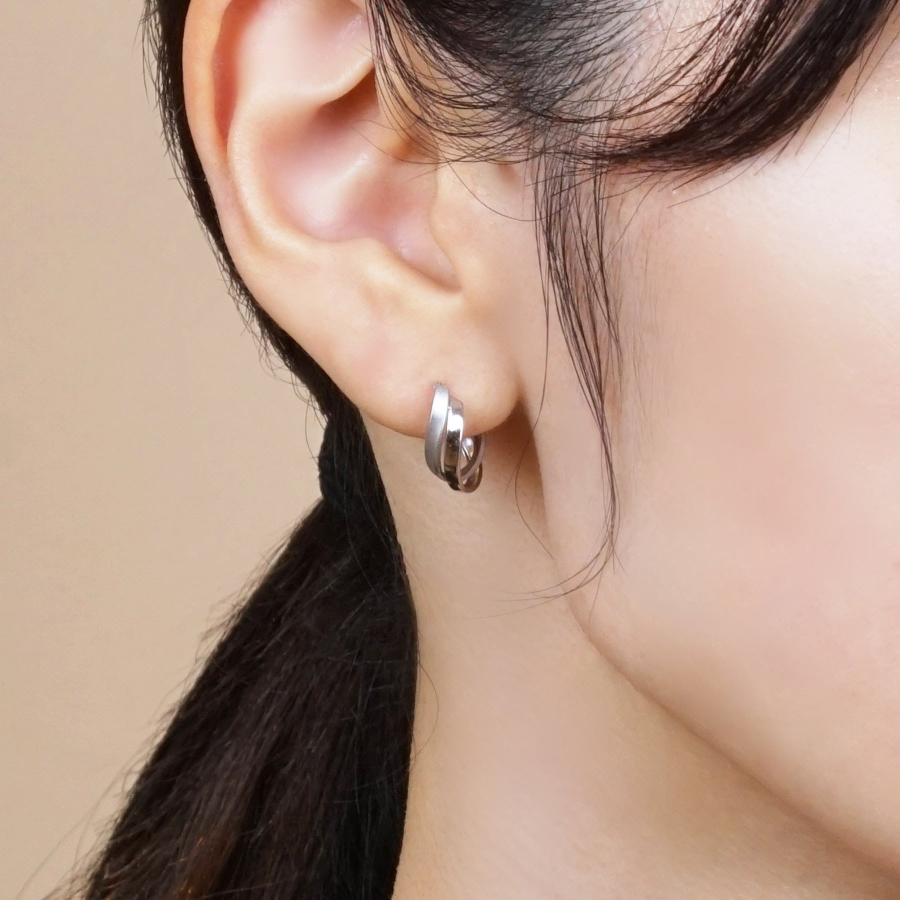 14K/10K White Gold Twisted Twin Hoop Earrings - Model Image