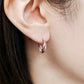 18K/10K Rose Gold Twisted Twin Hoop Earrings - Model Image