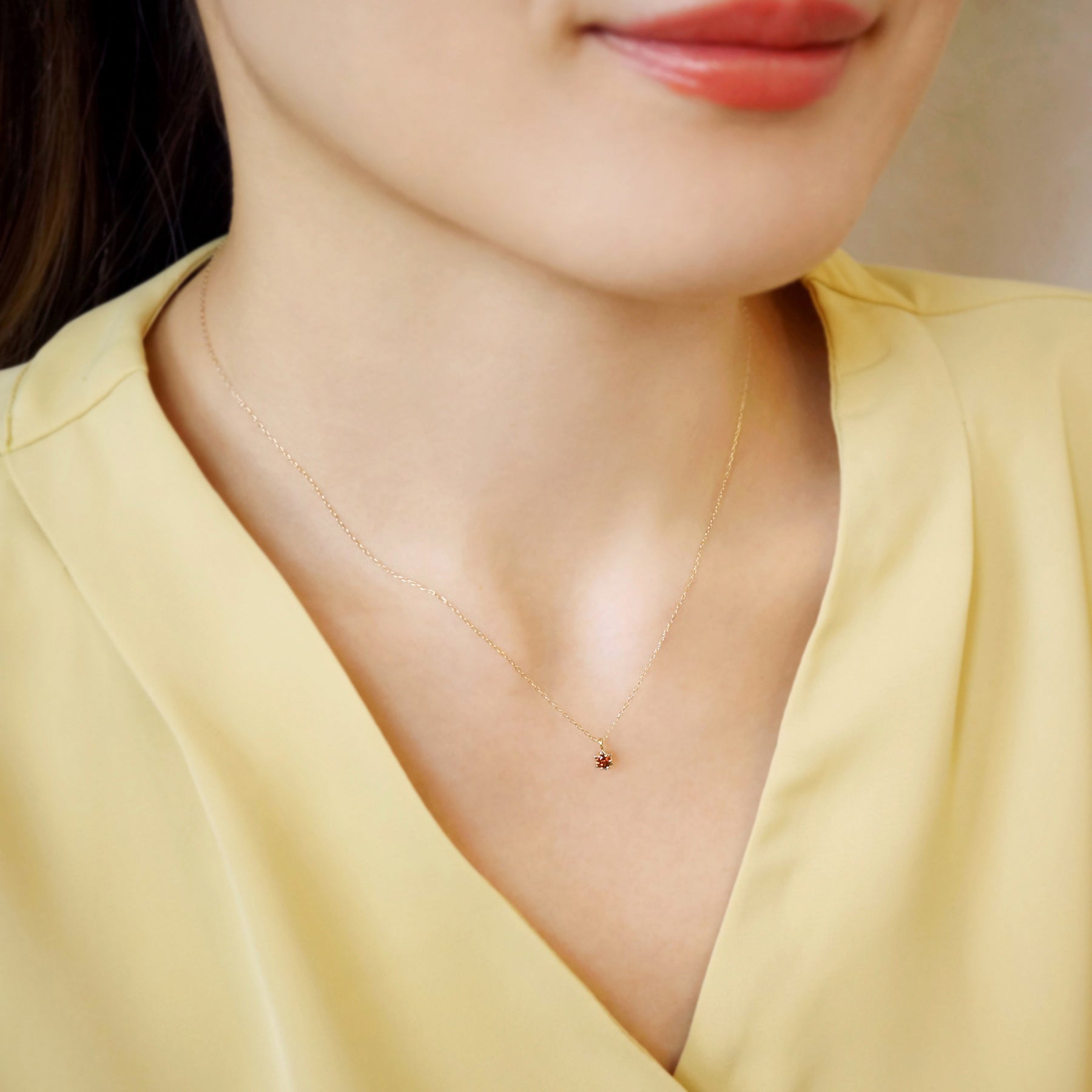 10K Yellow Gold Garnet Starlet Birthstone Necklace - Model Image