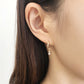 18K Yellow Gold Diamond Twisted Earrings - Model Image
