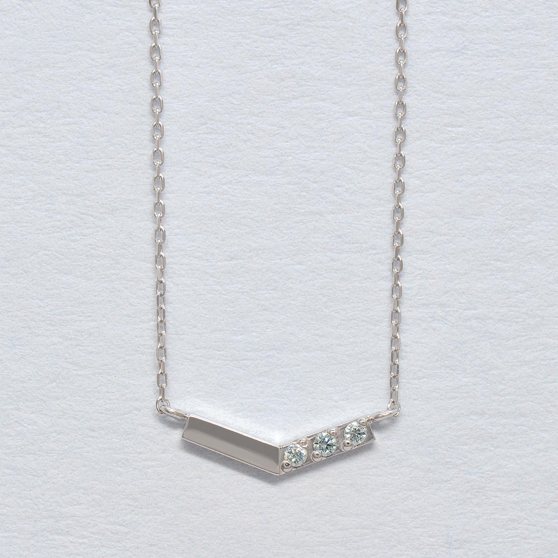 10K White Gold Ice Blue Diamond V-Shaped 3-Stone Necklace - Product Image