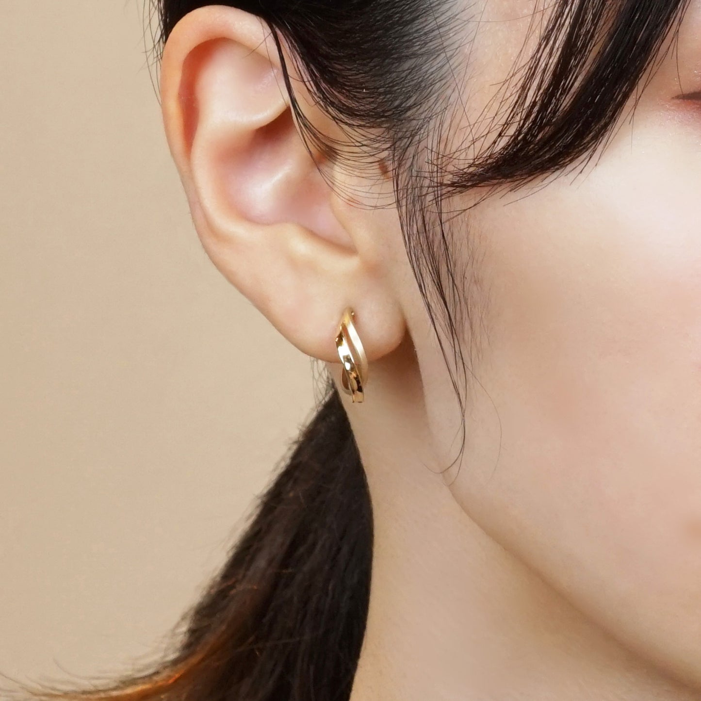 18K/10K Yellow Gold Twisted Twin Hoop Earrings - Model Image