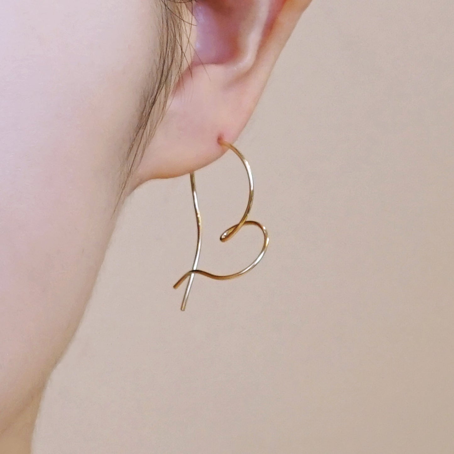 Gold Filled Twisted Heart Earrings - Model Image