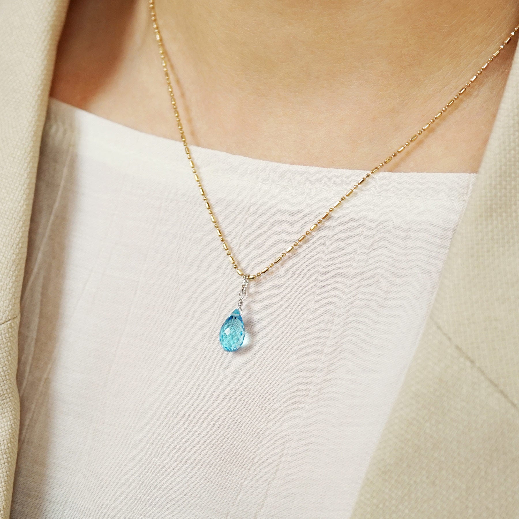 10K Blue Topaz Necklace Charm (White Gold) - Model Image