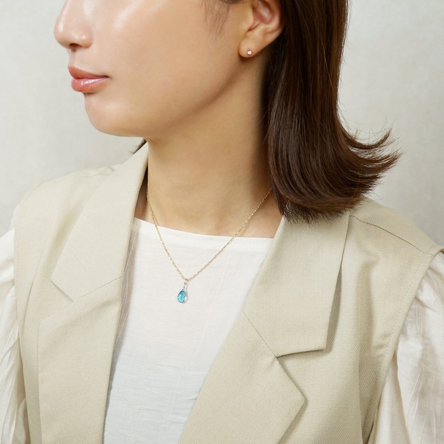 10K Blue Topaz Necklace Charm (White Gold) - Model Image