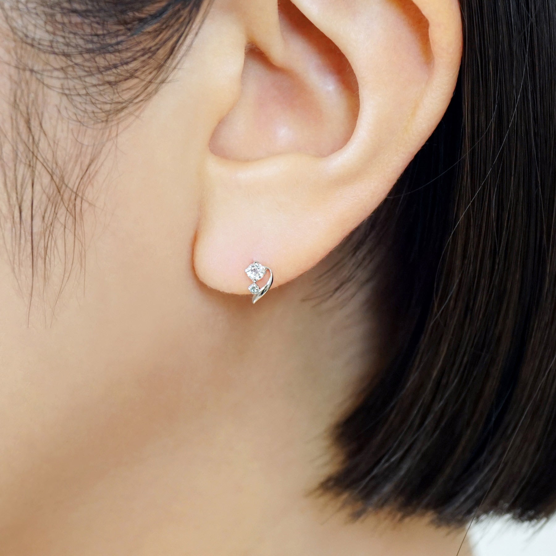 14K/10K Ice Blue Diamond Twisted Line Earrings (White Gold) - Model Image