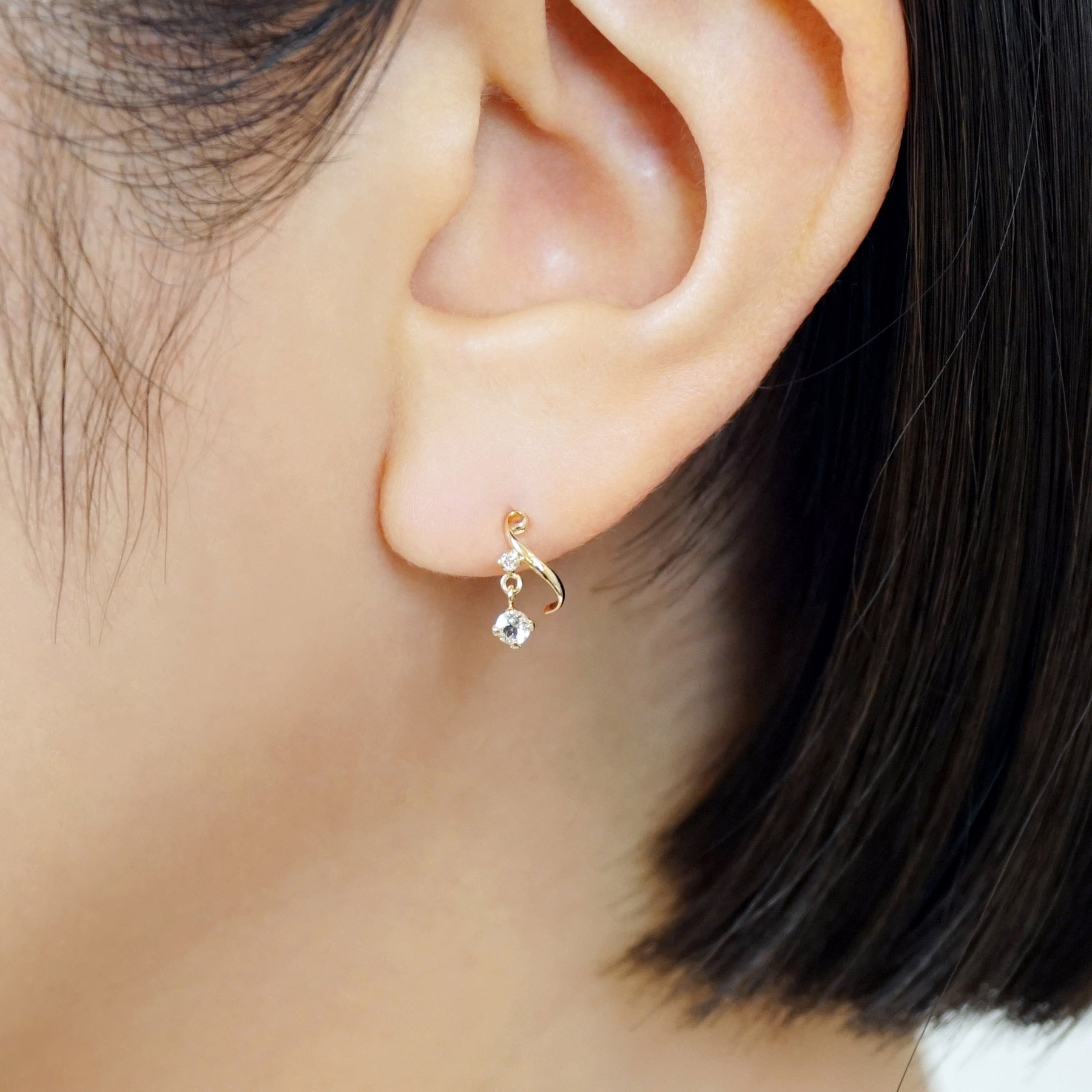 18K/10K Diamond Twisted Swinging Earrings (Yellow Gold) - Model Image
