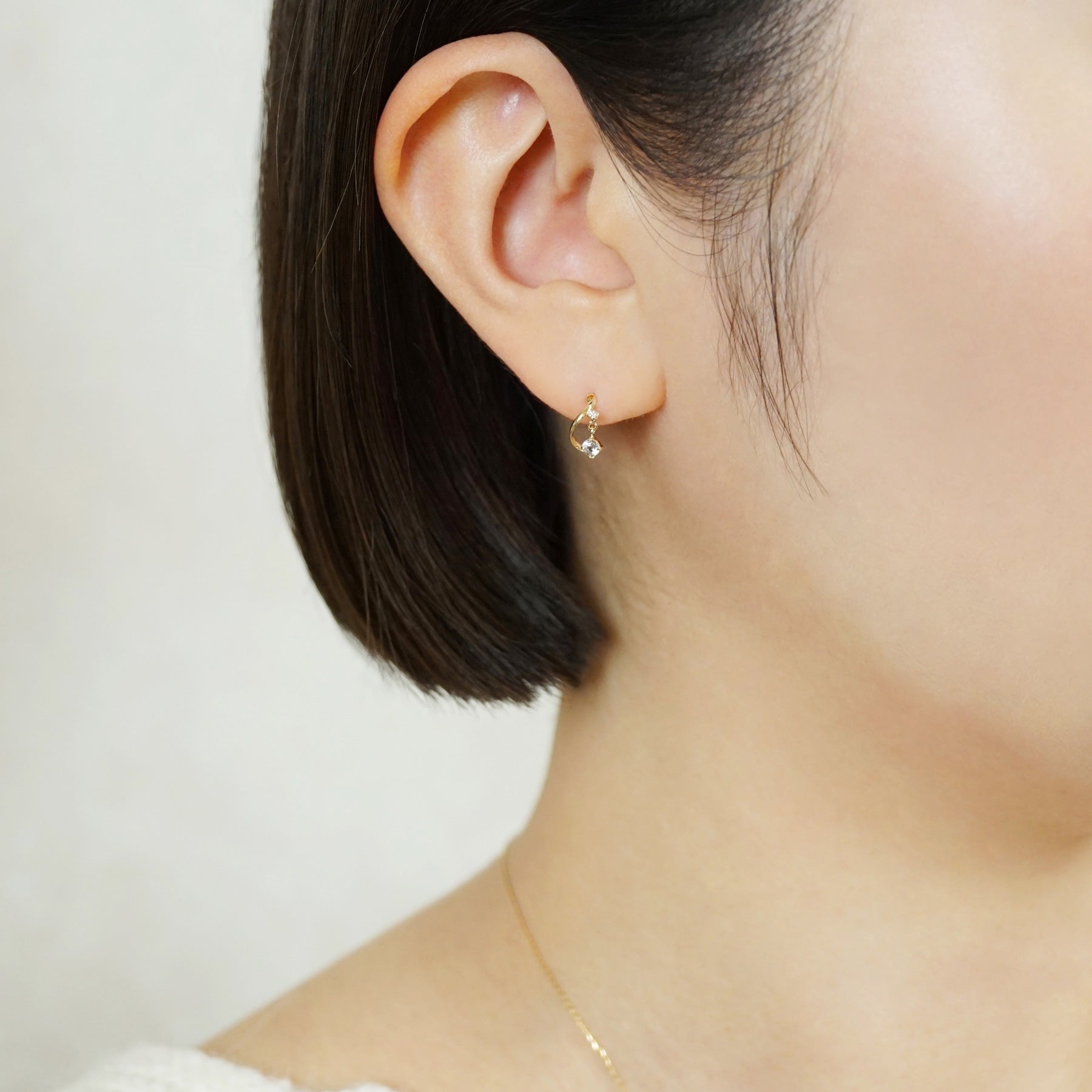 18K/10K Diamond Twisted Swinging Earrings (Yellow Gold) - Model Image