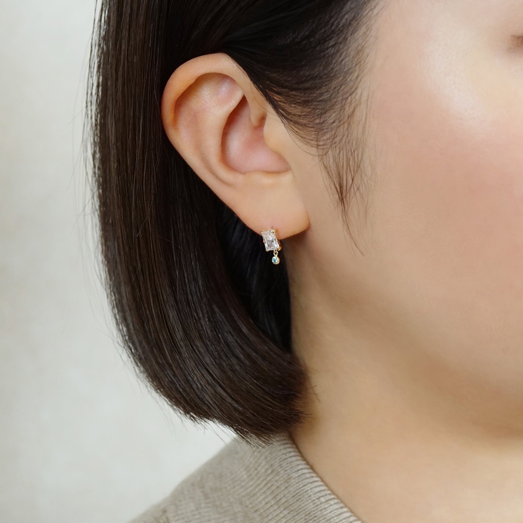 10K Clear Color Baguette Swinging Earrings (Yellow Gold) - Model Image