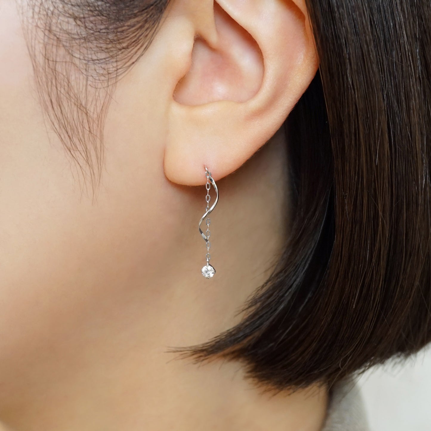 10K Glittering Twisted Dangle Earrings (White Gold) - Model Image