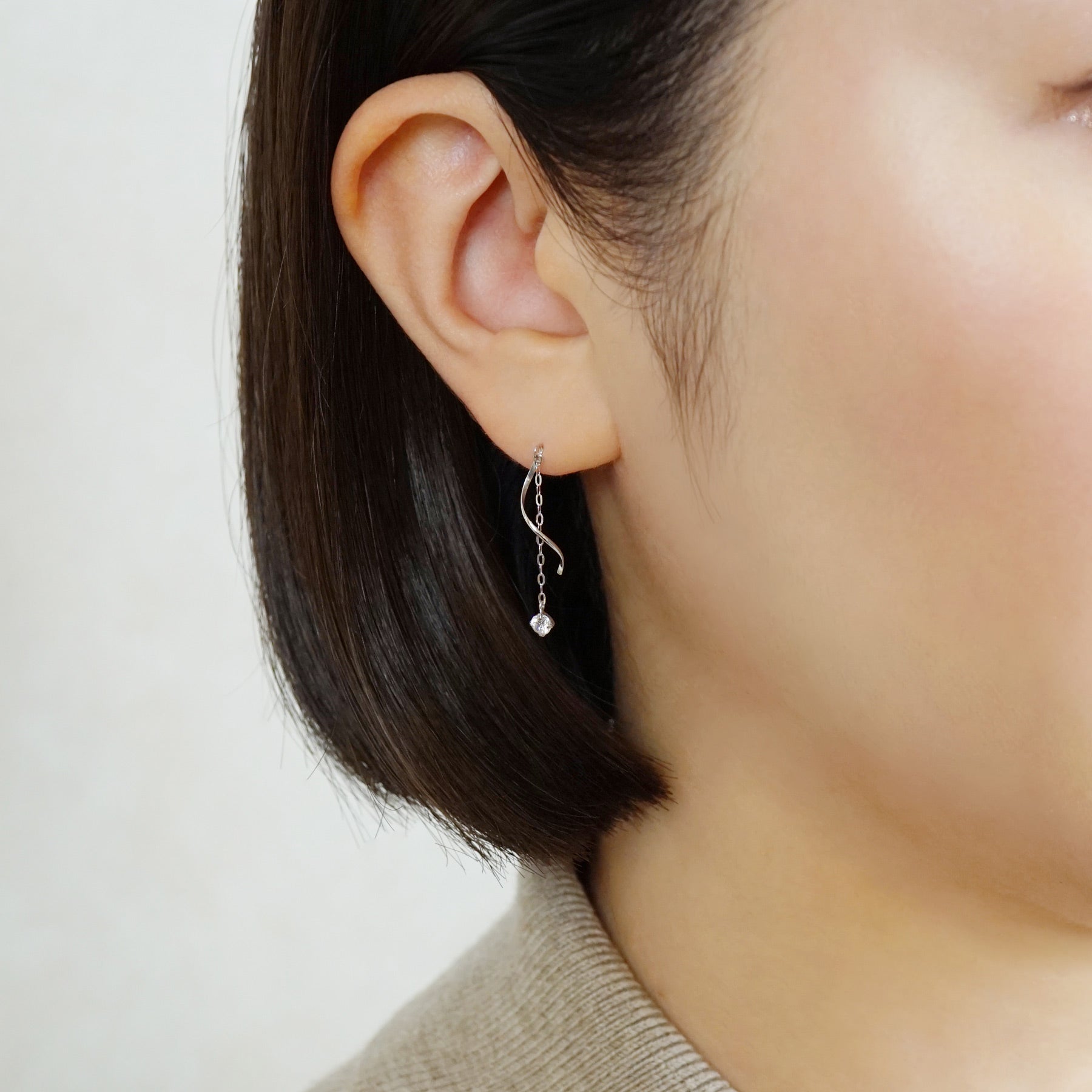 10K Glittering Twisted Dangle Earrings (White Gold) - Model Image