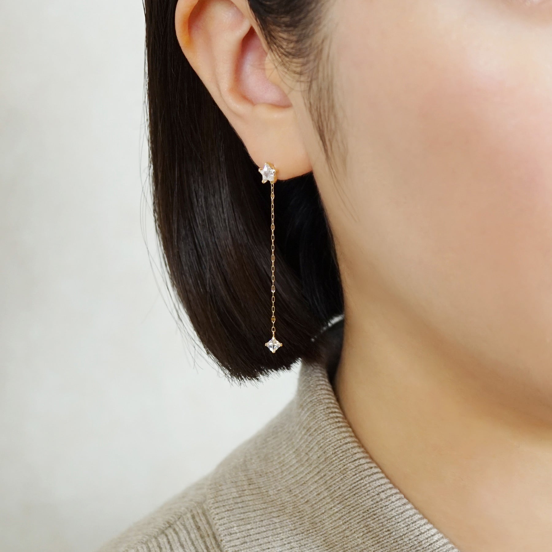 10K Star Long Dangle Earrings (Yellow Gold) - Model Image