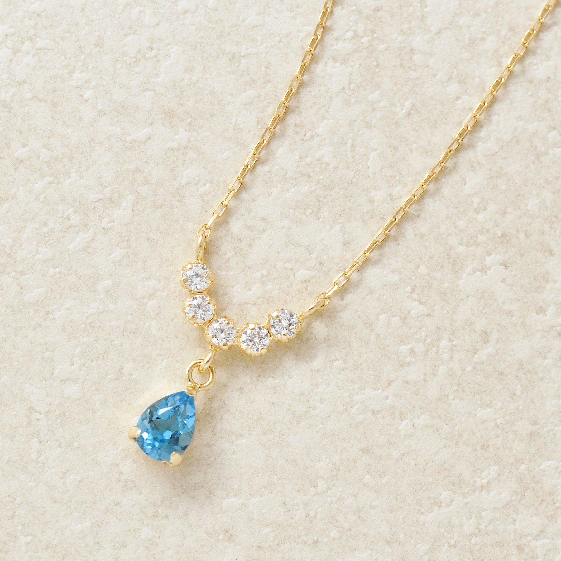 10K Yellow Gold Birthstone (Swiss Blue Topaz) Swinging Necklace - Product Image