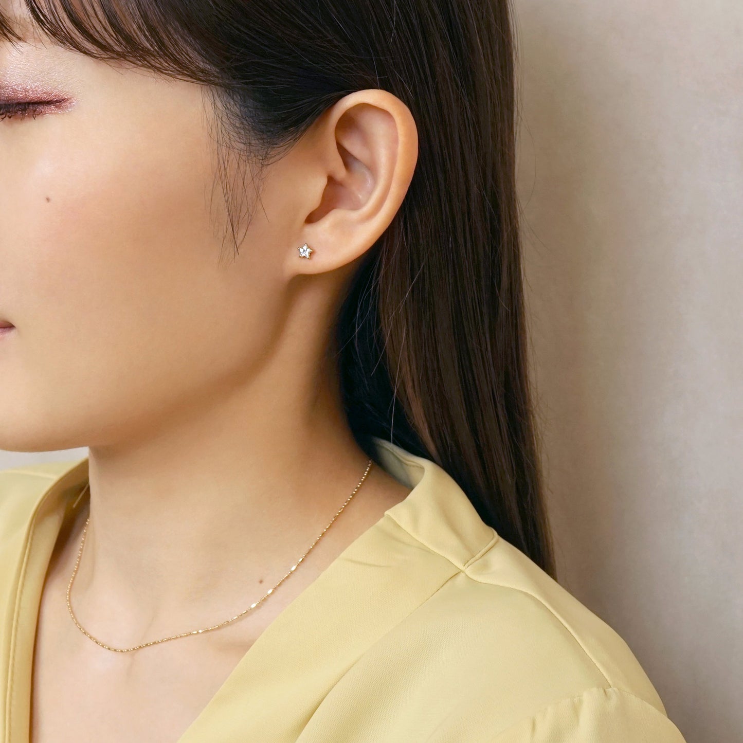 [Second Earrings] 18K Yellow Gold Star Cut Clear Cubic Zirconia Earrings - Model Image