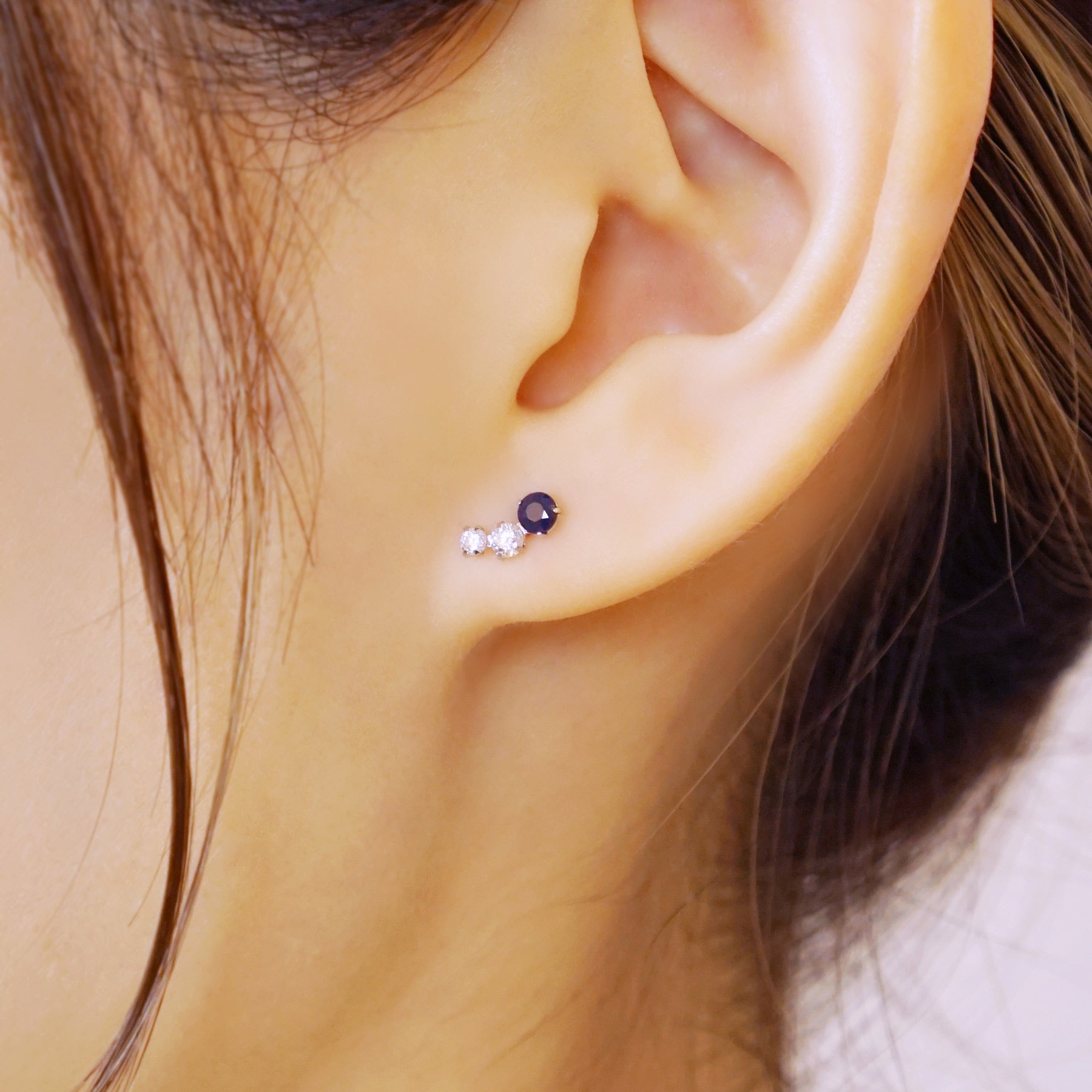 14K/10K White Gold Blue Sapphire Stud Earrings - Model Image