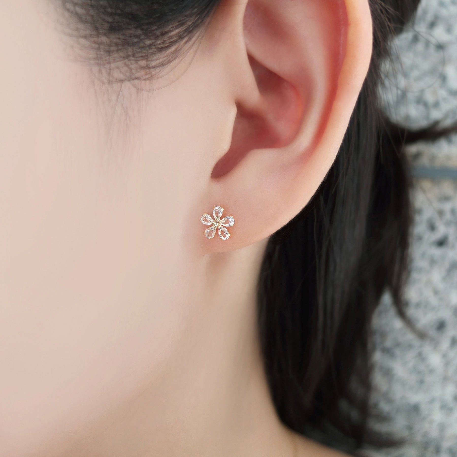 18K / 10K Yellow Gold White Topaz Flower Earrings - Model Image