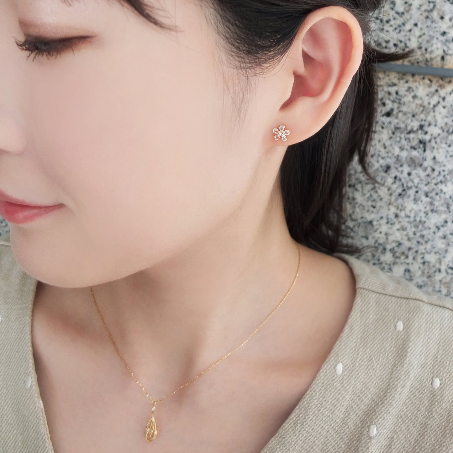18K / 10K Yellow Gold White Topaz Flower Earrings - Model Image